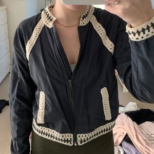 grey jacket with crochet details